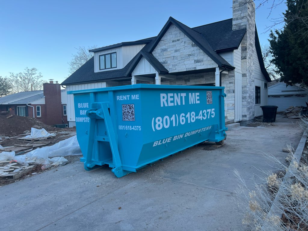 Blue Bin residential dumpster placed in a homeowner's driveway